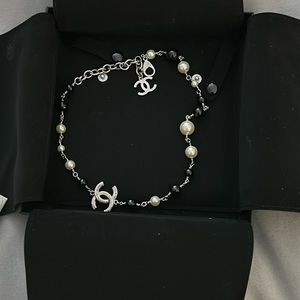 Nwt chanel cc necklace with white and black beads…silver. 19 inches
